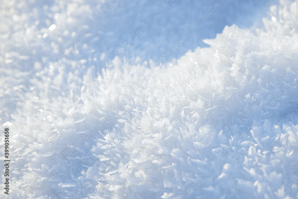 Naklejka premium Hoarfrost background texture. Fresh ice and snow winter backdrop with snowflakes and mounds. Seasonal wallpaper. Frozen water geometrical shapes and figures. Cold weather atmospheric precipitation.