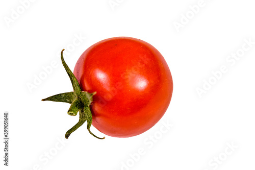 One small cherry tomato isolated on a white background