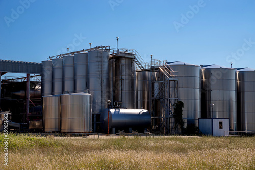 Vertical winemaking tanks.