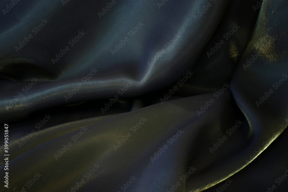 Black and gold silk fabric texture background Black and gold silk fabric texture background