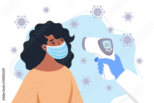 Checking body temperature with an infrared thermometer