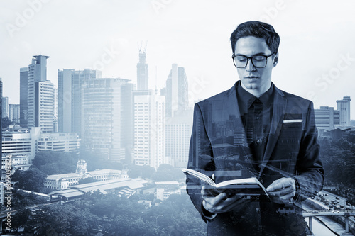 Canvas Print Young handsome businessman in suit and glasses thinking how to tackle the problem, new career opportunities, MBA assignment
