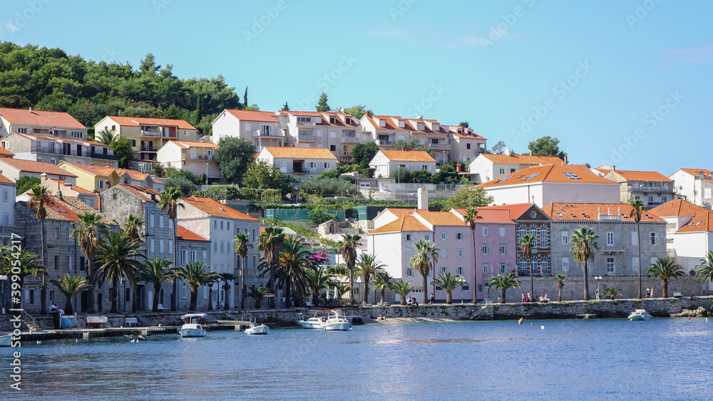 Close-up view of Korcula bay with houses and boats