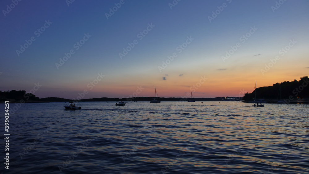 Sunset on Hvar Island Croatia with boats