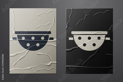 White Kitchen colander icon isolated on crumpled paper background. Cooking utensil. Cutlery sign. Paper art style. Vector.