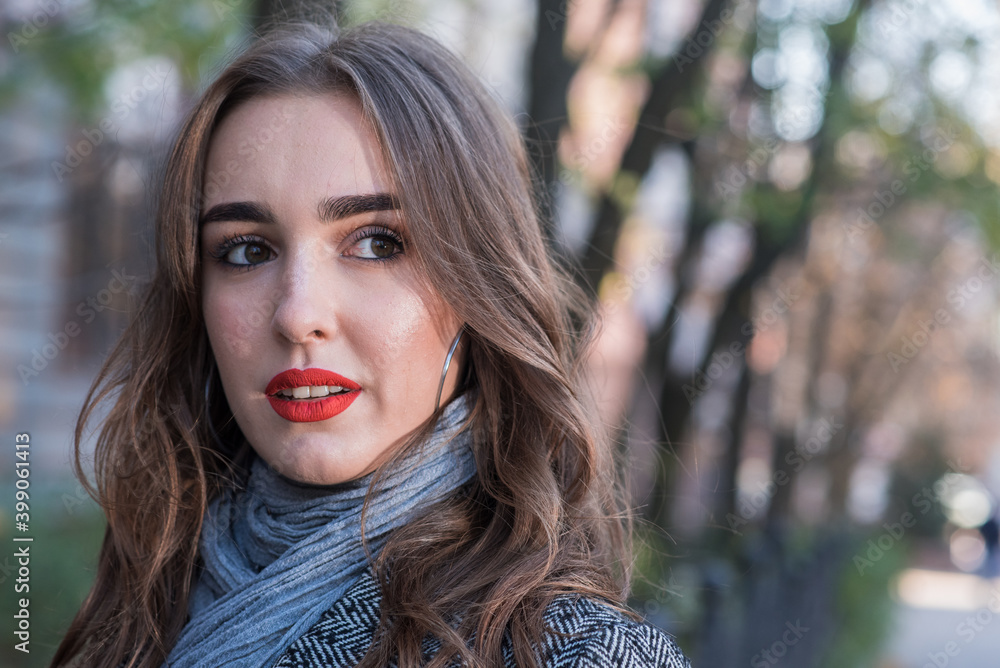 Portrait of a beautiful and happy girl outdoors. Beauty and fashion Portrait of a beautiful and happy girl outdoors. Beauty and fashion