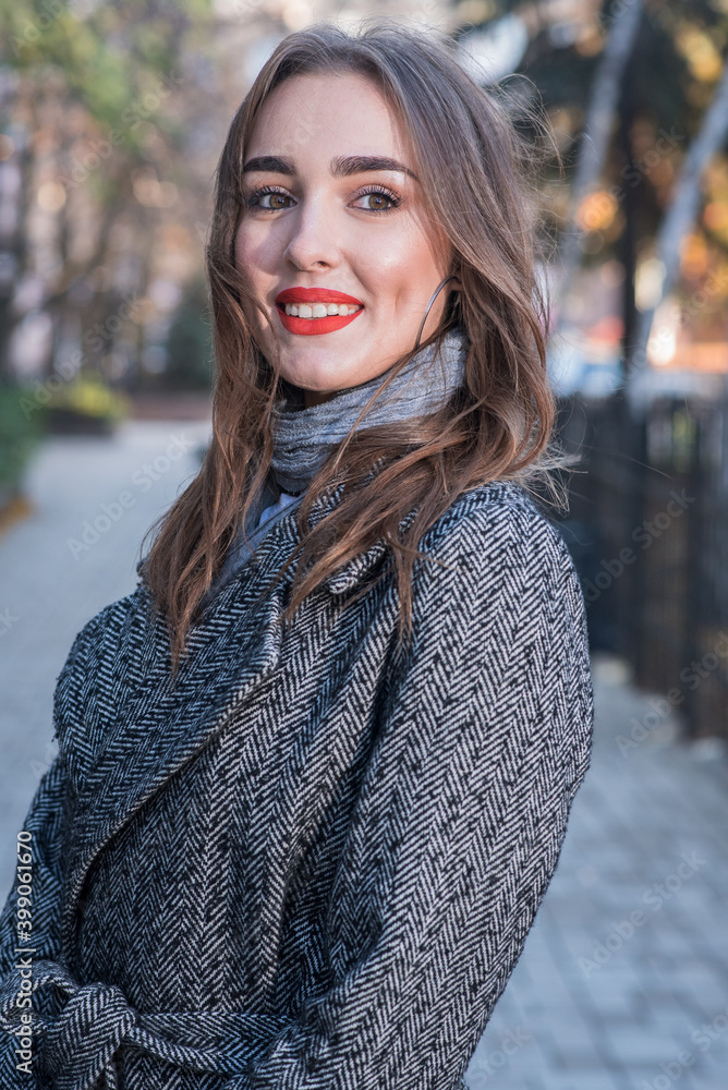 Portrait of a beautiful and happy girl outdoors. Beauty and fashion Portrait of a beautiful and happy girl outdoors. Beauty and fashion