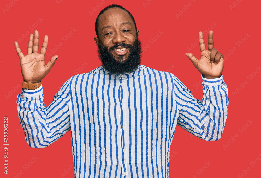 Young african american man wearing business shirt showing and pointing up with fingers number eight while smiling confident and happy. Young african american man wearing business shirt showing and pointing up with fingers number eight while smiling confident and happy.