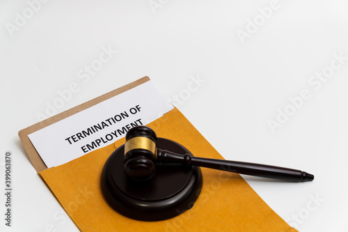 Billede på lærred The concept of labor law regarding unemployment: termination of employment letter is placed with wooden gavel and/or justice scales