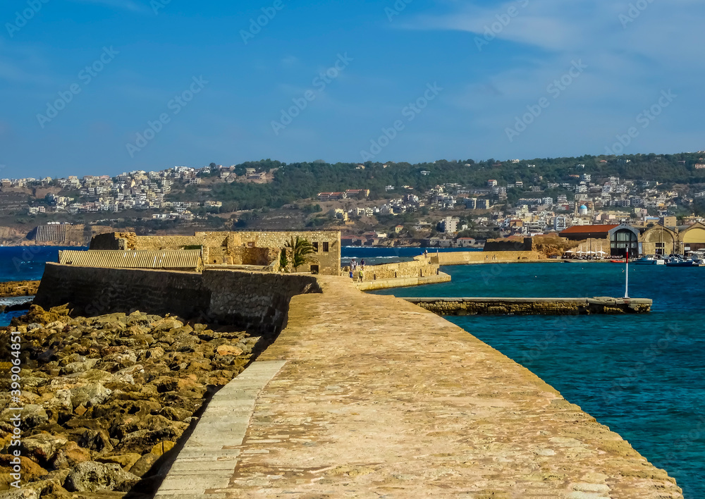 A panorama view along the harbour wall in Chania, Crete on a bright sunny day