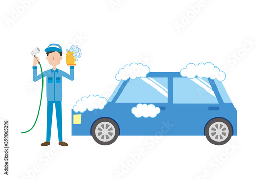 青い車を洗車するスタッフ