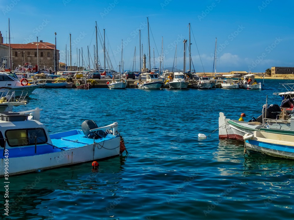 A view of boats moored in Chania harbour, Crete on a bright sunny day