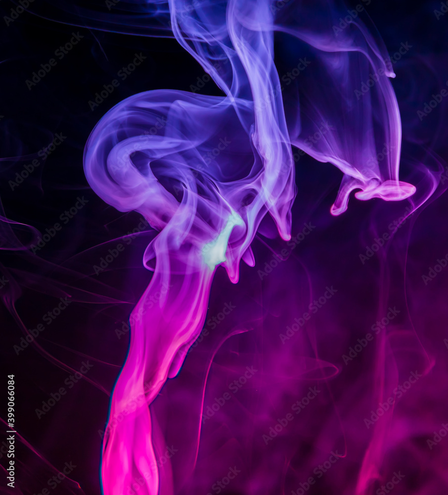 Fototapeta premium Colored smoke on black background