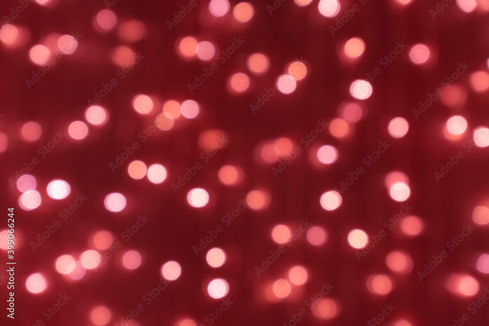 defocused picture of bokeh for christmas and new year celebration on red background defocused picture of bokeh for christmas and new year celebration on red background