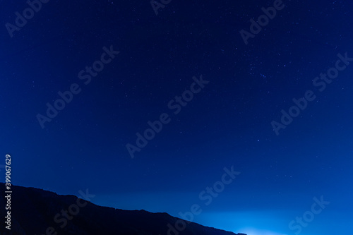 night view of city and starry sky from mountainside © Taisuke Mizuguchi