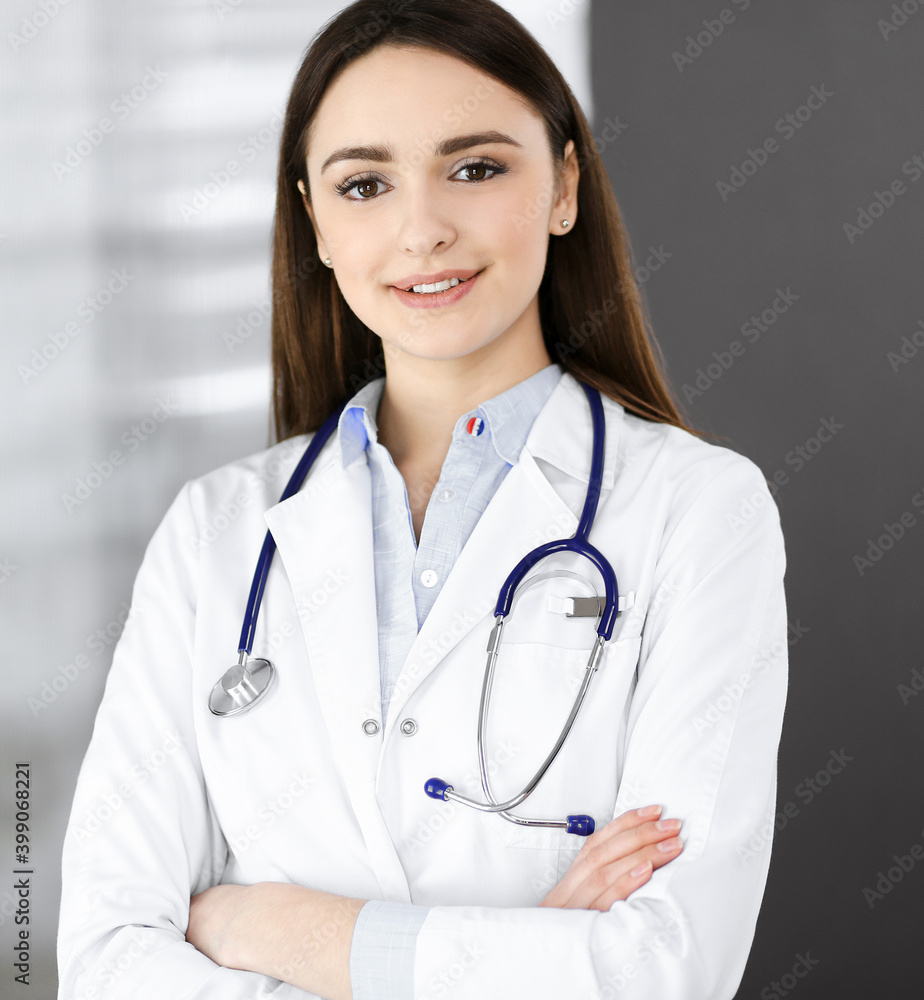 Smiling young woman-doctor is filling up medical recommendations using a clipboard. Therapist at work in a clinic office. Medicine concept Smiling young woman-doctor is filling up medical recommendations using a clipboard. Therapist at work in a clinic office. Medicine concept
