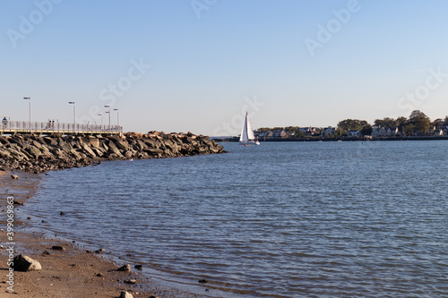 Cummings Park Beach in Stamford Connecticut along Westcott Cove with a Sailboat