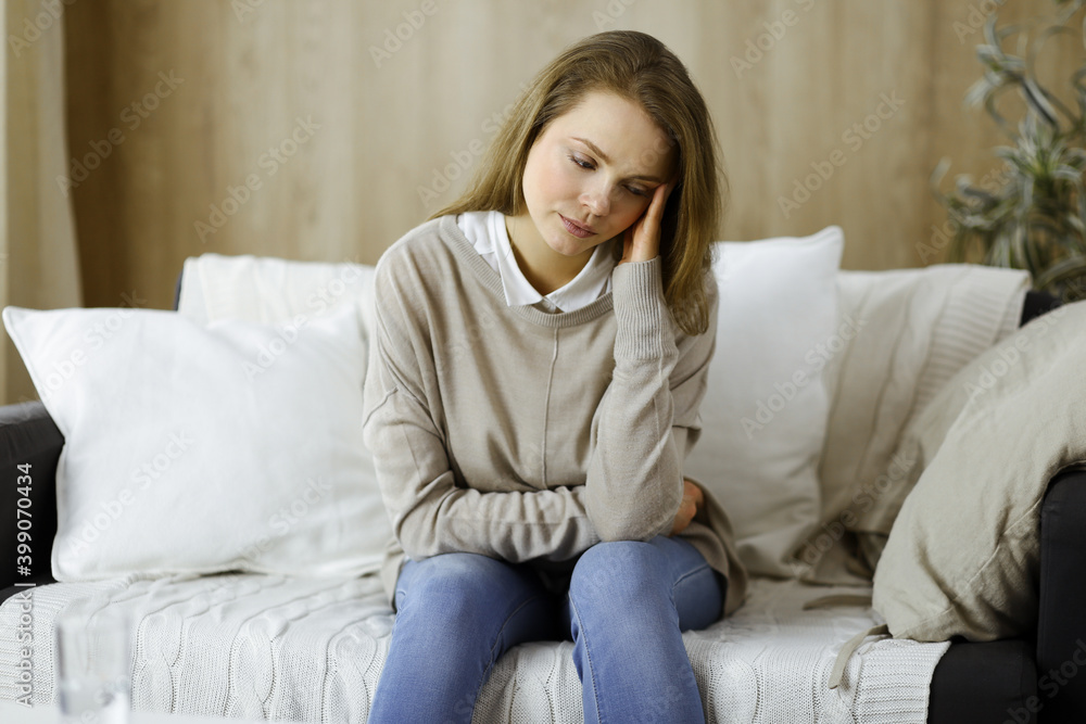 Tired upset woman worried about tiredness from work at home office and self isolation quarantine for COVID-19 Coronavirus. Mental health, anxiety depressed thinking young lady Tired upset woman worried about tiredness from work at home office and self isolation quarantine for COVID-19 Coronavirus. Mental health, anxiety depressed thinking young lady