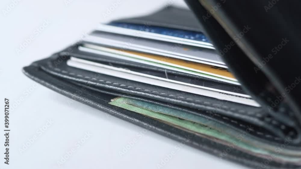 Close up of cash in wallet on table. Close up of cash in wallet on table.