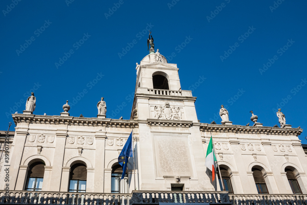 white building with flags on Piazza delle Erbe, Padova, Italy