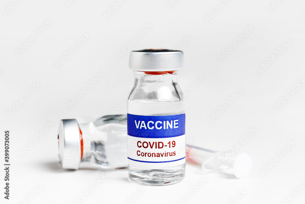 Macro shot of antiviral vaccine vial for immunization against covid-19 virus. Isolated on white background with copy space for text. Close up, top view. Macro shot of antiviral vaccine vial for immunization against covid-19 virus. Isolated on white background with copy space for text. Close up, top view.