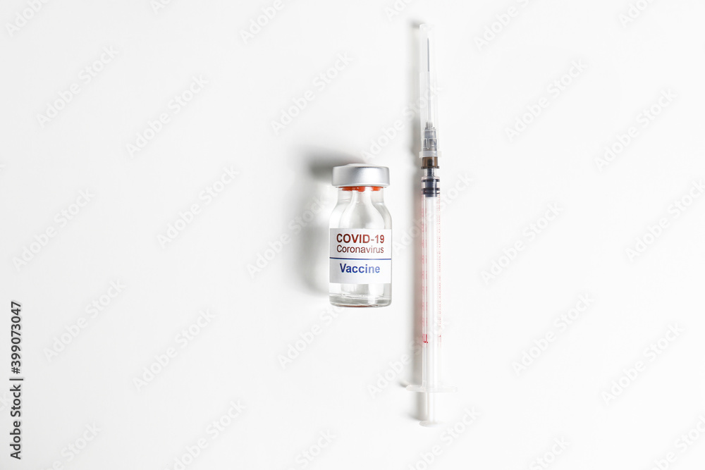 Macro shot of antiviral vaccine vial for immunization against covid-19 virus. Isolated on white background with copy space for text. Close up, top view. Macro shot of antiviral vaccine vial for immunization against covid-19 virus. Isolated on white background with copy space for text. Close up, top view.