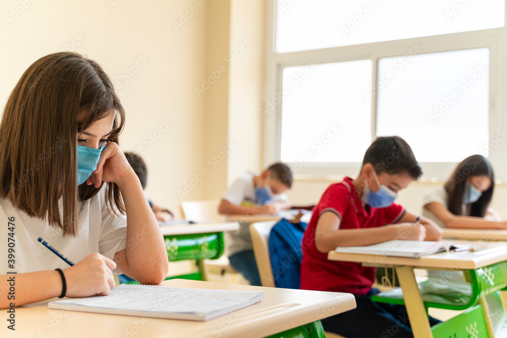 Group of students with face mask back at school after covid-19 quarantine and lockdown