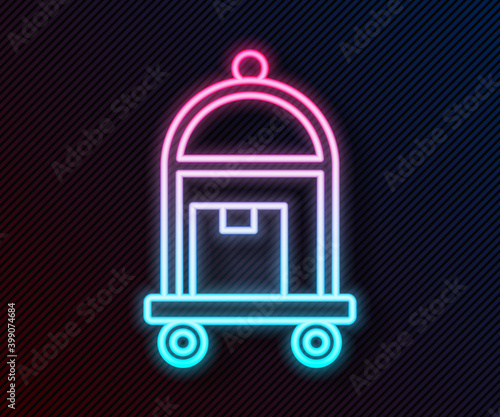 Glowing neon line Hotel luggage cart with suitcase icon isolated on black background. Traveling baggage sign. Travel luggage icon. Vector.