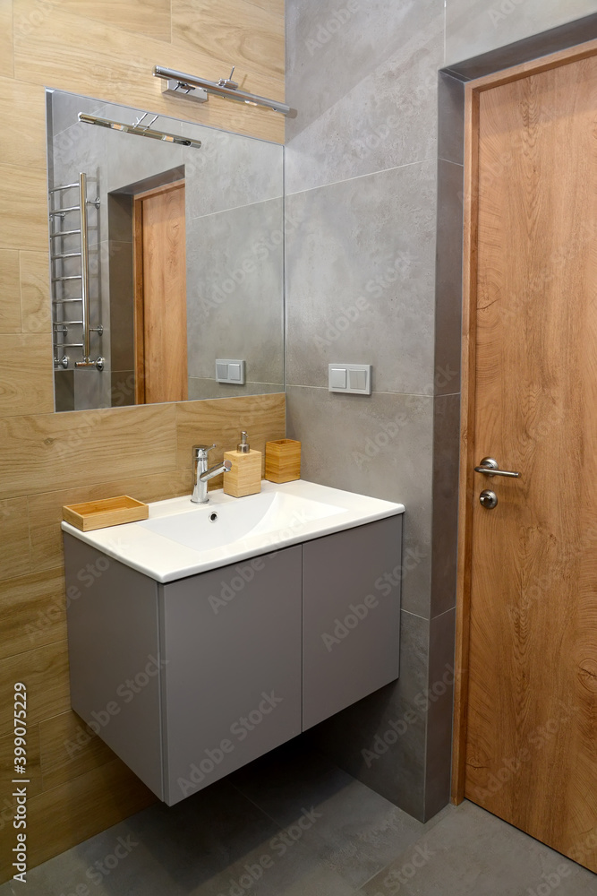 A fragment of the interior of a bathroom with a washbasin. Modern minimalism A fragment of the interior of a bathroom with a washbasin. Modern minimalism