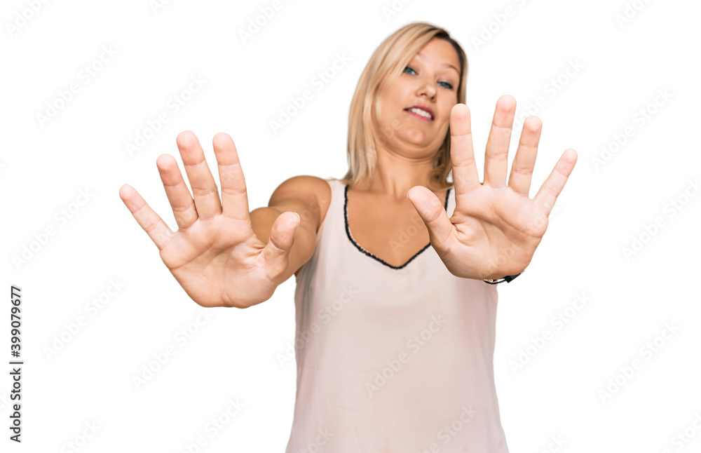 Middle age caucasian woman wearing casual clothes doing stop gesture with hands palms, angry and frustration expression Middle age caucasian woman wearing casual clothes doing stop gesture with hands palms, angry and frustration expression