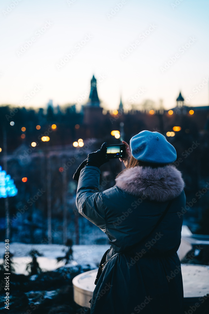 girl photographing the evening city girl photographing the evening city