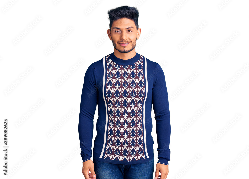 Handsome latin american young man wearing casual winter sweater with a happy and cool smile on face. lucky person. Handsome latin american young man wearing casual winter sweater with a happy and cool smile on face. lucky person.