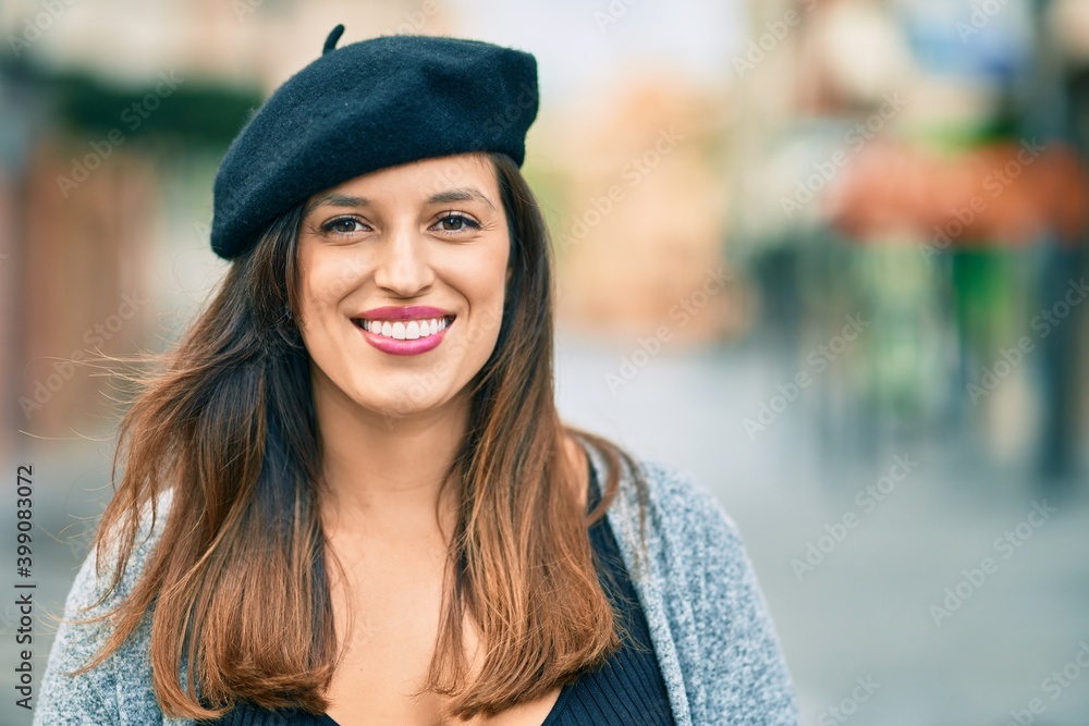 Young latin woman wearing french style standing at the city. Young latin woman wearing french style standing at the city.