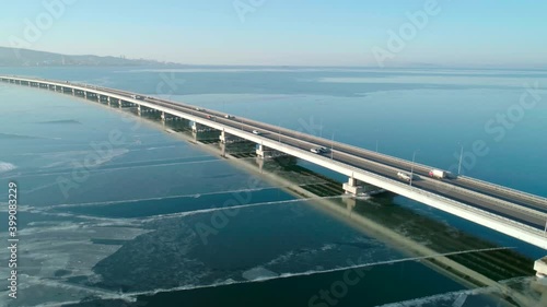 Wallpaper Mural Aerial drone view of low-water bridge across the bay with moving car. Active movement of transport cars vehicles in different directions. Torontodigital.ca