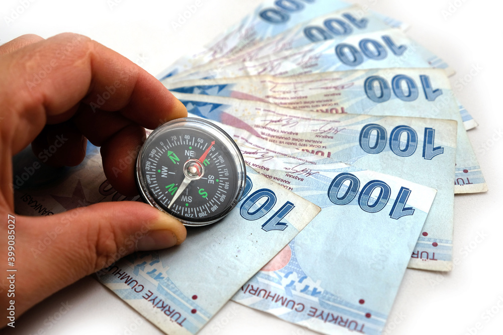 compass and 100 turkish lira close-up. to use Turkish lira for economy and investment, correct and accurate investment, compass and 100 turkish lira close-up. to use Turkish lira for economy and investment, correct and accurate investment,