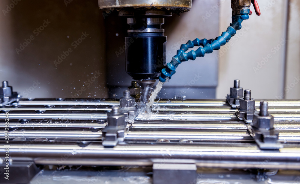 CNC milling machine drills holes in the pipe. CNC milling machine drills holes in the pipe.