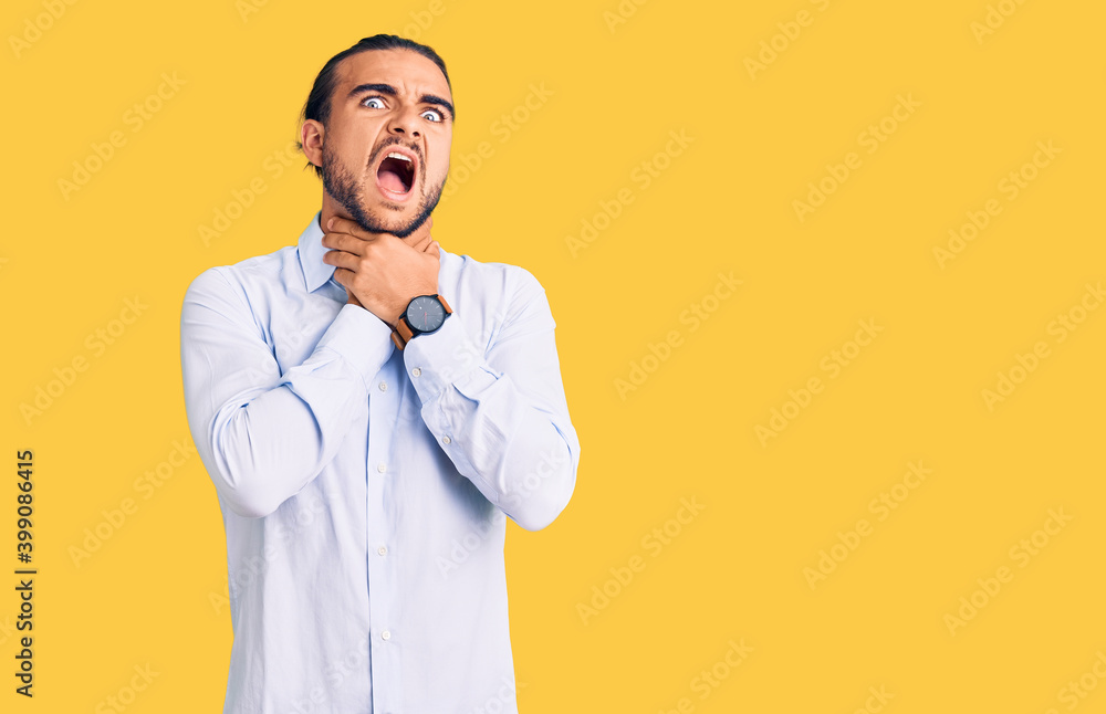 Young handsome man wearing business clothes shouting suffocate because painful strangle. health problem. asphyxiate and suicide concept. Young handsome man wearing business clothes shouting suffocate because painful strangle. health problem. asphyxiate and suicide concept.