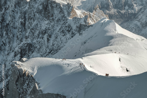 A group of climbers descends on a snowy slope. France, Mont Blanc.