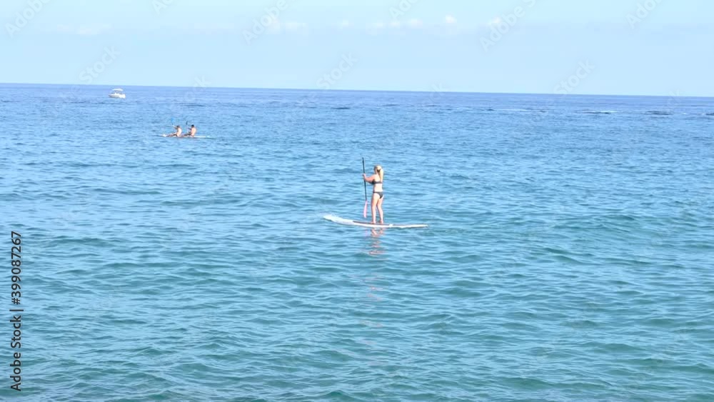 Active Woman Stand Up Paddle Boarding On Summer Day Active Woman Stand Up Paddle Boarding On Summer Day