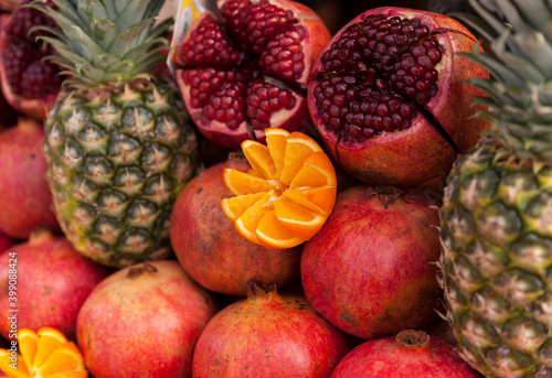 Oranges pomegranate and pineapple in the street market in Istanbul.Fresh fruits for fresh juice  