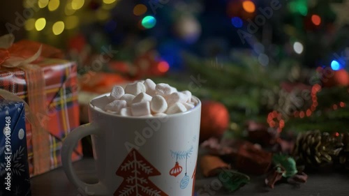 Wallpaper Mural A woman puts cocoa whit marshmallows on wood table. Christmas, New Year concept background. Winter holidays Torontodigital.ca