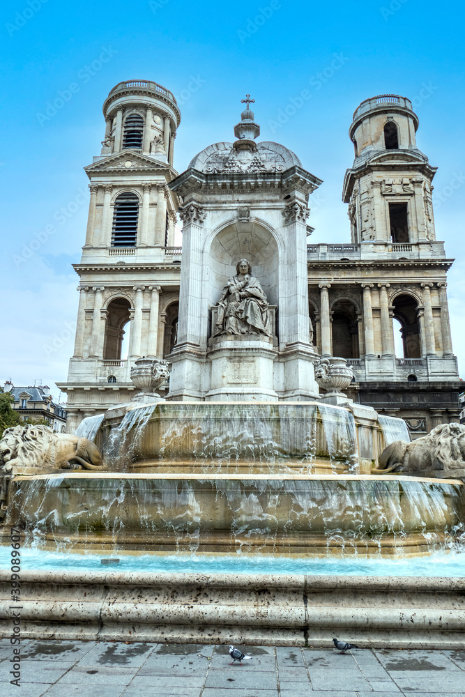 The church of Saint Sulpice in Paris with a beautiful fountain The church of Saint Sulpice in Paris with a beautiful fountain