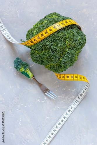  Broccoli and centimeter. Fresh egetable, concept for weight loss, diet, ketogenic diet, intermittent fasting. photo