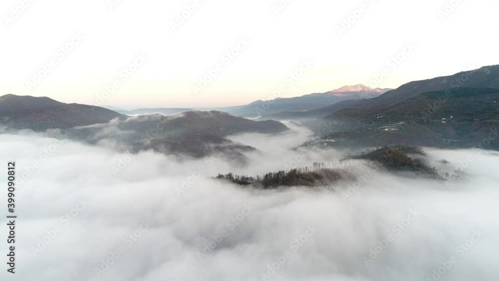 Flying through the clouds at dawn above the jumping lake in Rieti Flying through the clouds at dawn above the jumping lake in Rieti