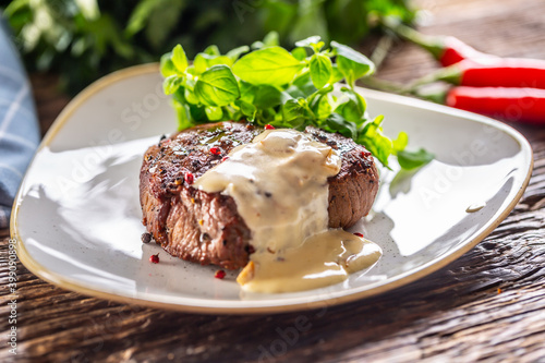 Принти на полотні Cooked steak with mushroom sauce and green salad on the side