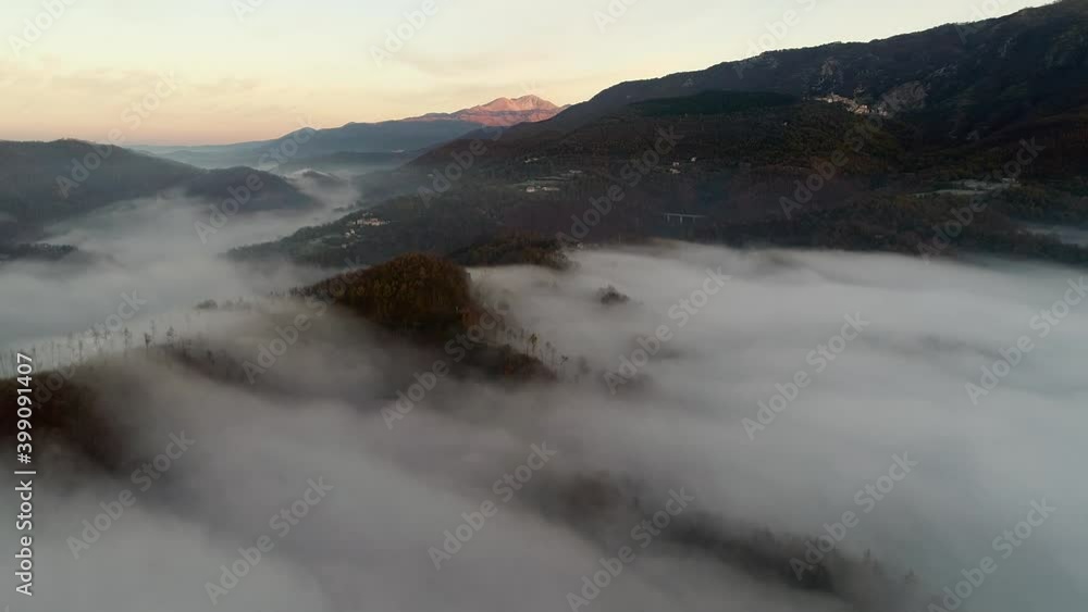 Flying through the clouds at dawn above the jumping lake in Rieti Flying through the clouds at dawn above the jumping lake in Rieti