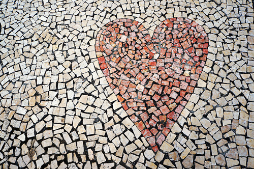 Red heart. Mosaic paving tile in Funchal, Madeira, Portugal. photo