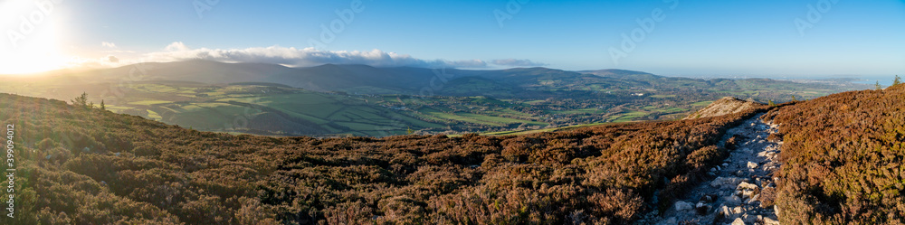 Panoramic view from the top of Great Sugar Loaf in Ireland, Wicklow near Dublin. Amazing weather, Hills of green rural fields in the countryside