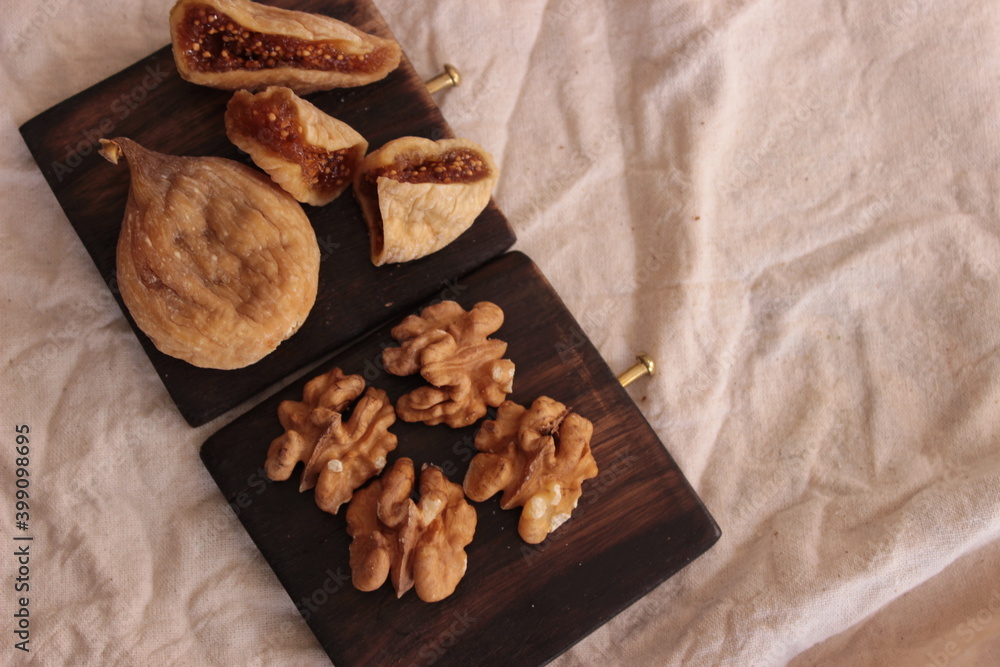 Top view dried fig and walnut are healthy food, healthy sugar for health life. Brown food