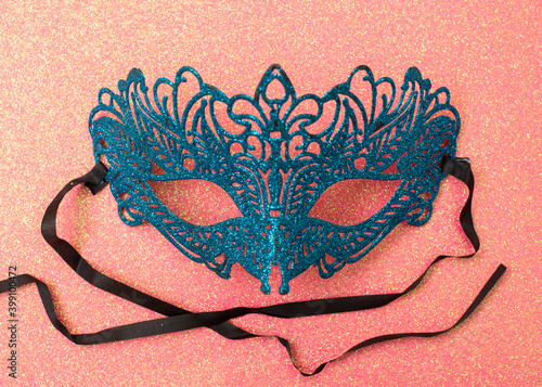 Female carnival mask on a red background. Mystery, incognito, seduction concept.